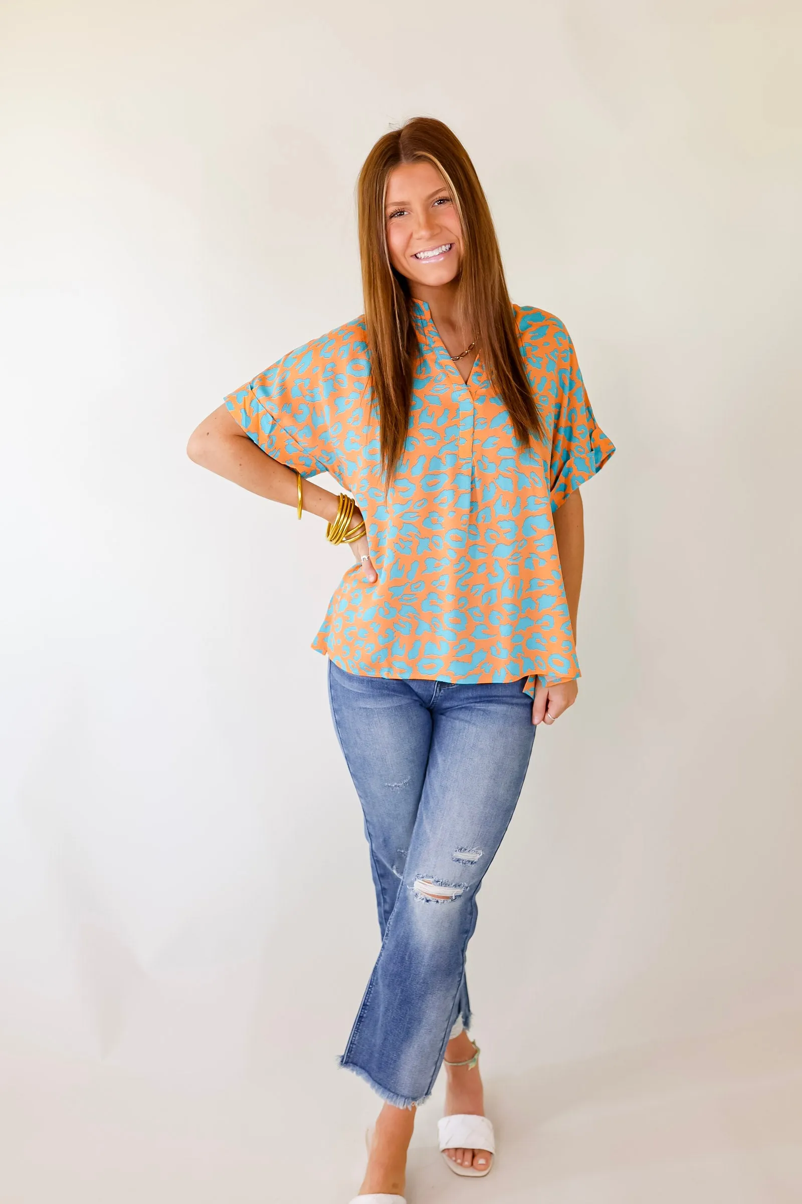 Bold and Beautiful V Neck Teal Leopard Print Top in Orange