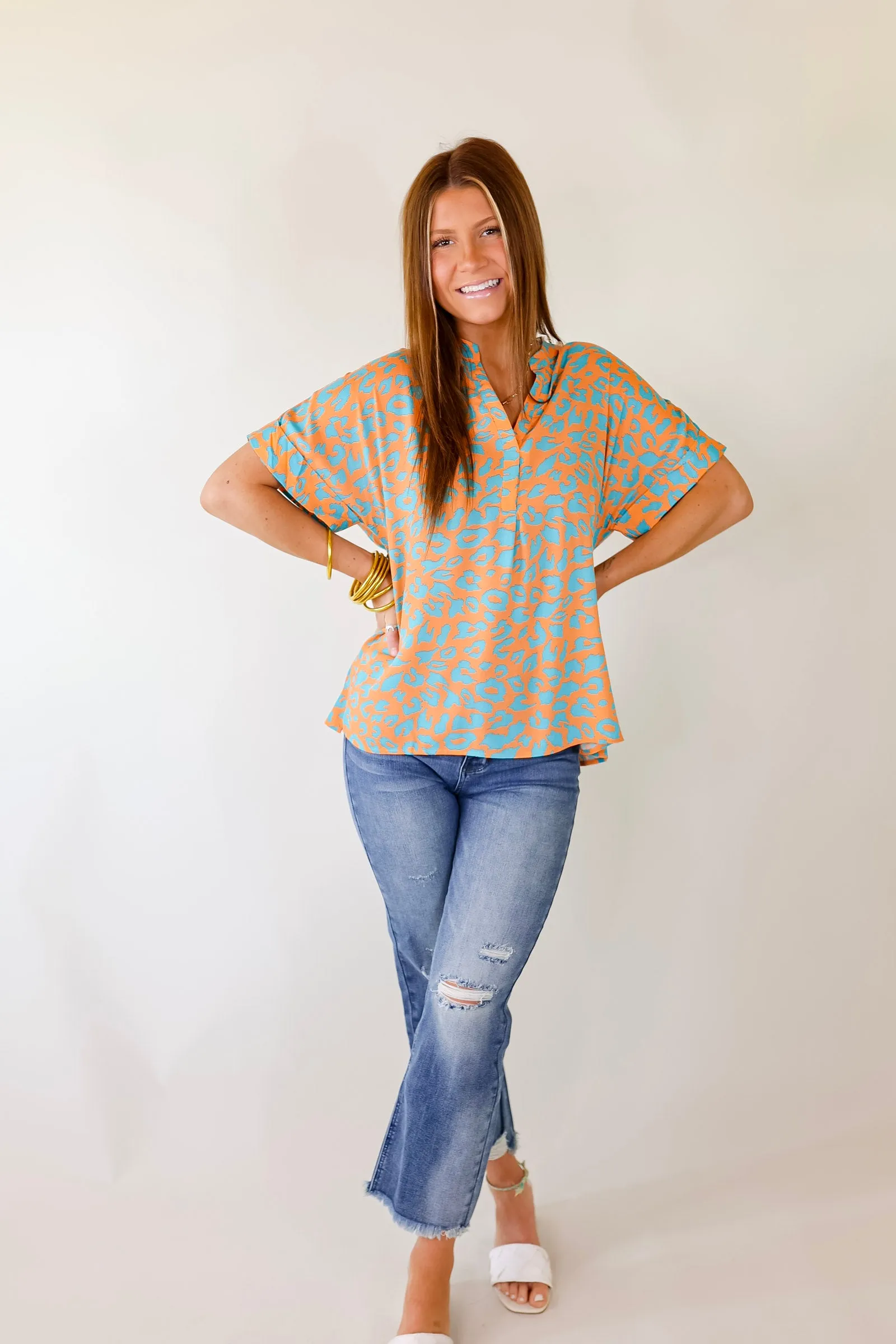 Bold and Beautiful V Neck Teal Leopard Print Top in Orange