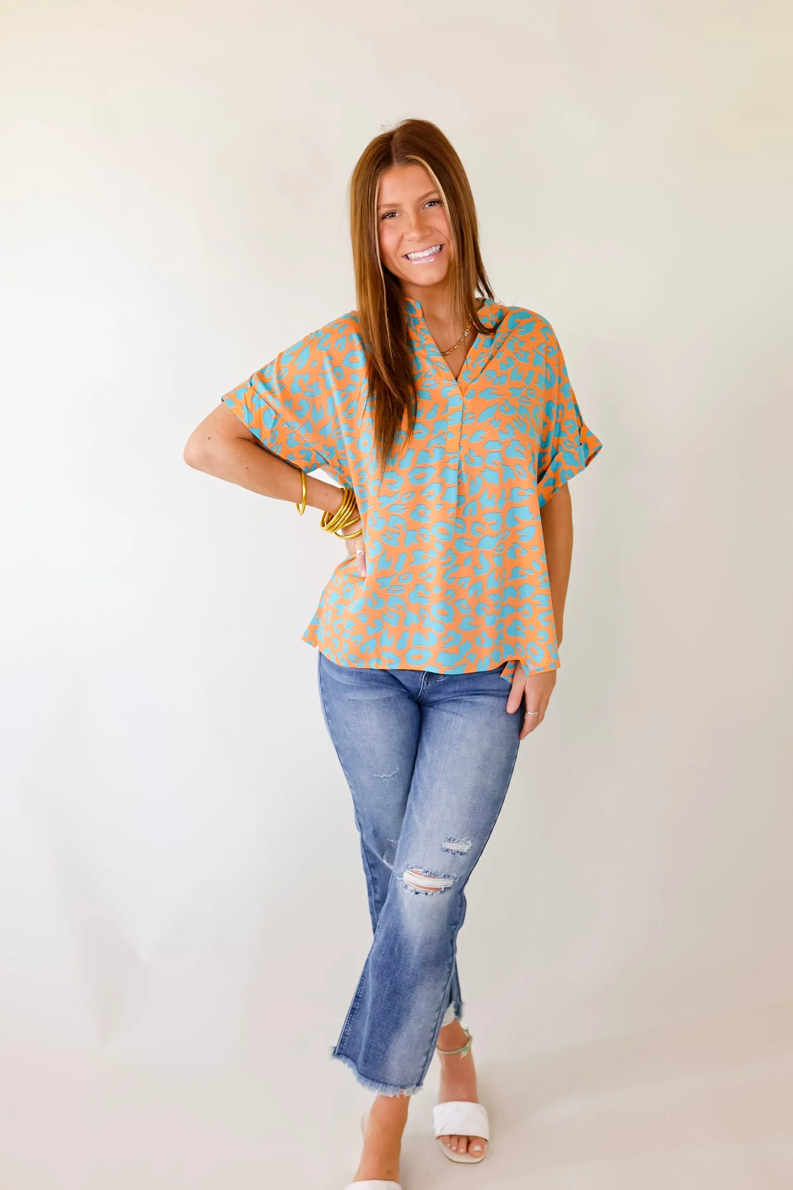 Bold and Beautiful V Neck Teal Leopard Print Top in Orange